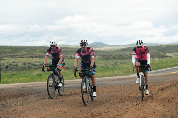 people biking on dirt