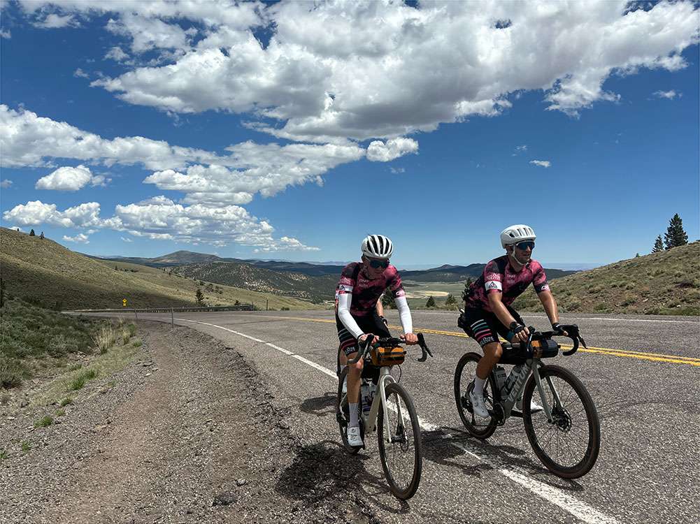 cyclist riding on side of road