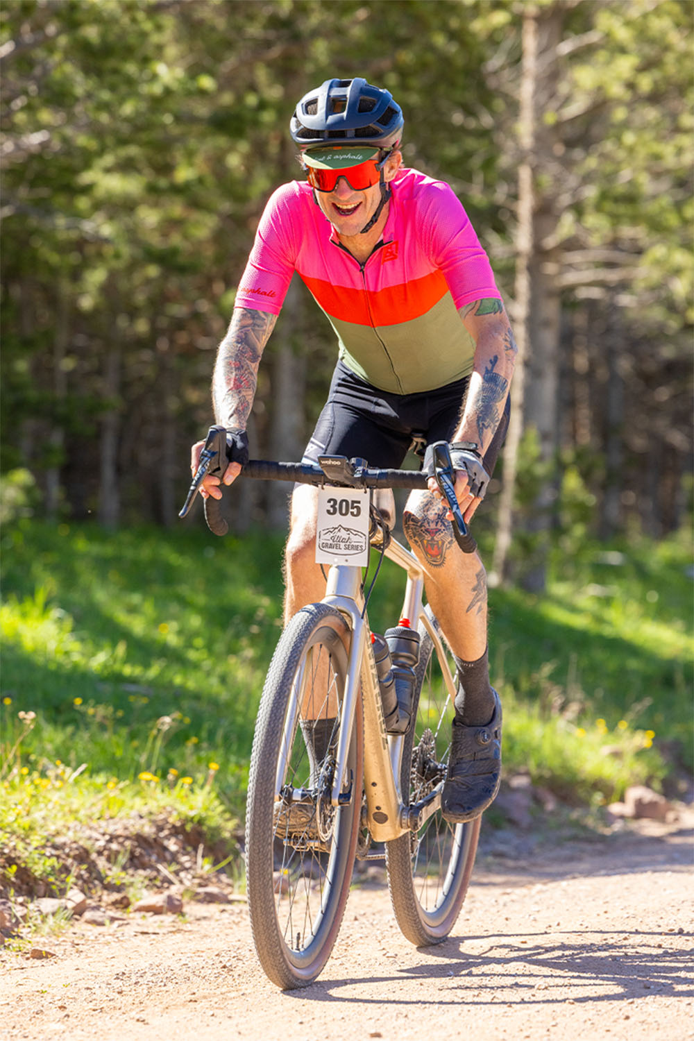 person in dna cycling kit racing