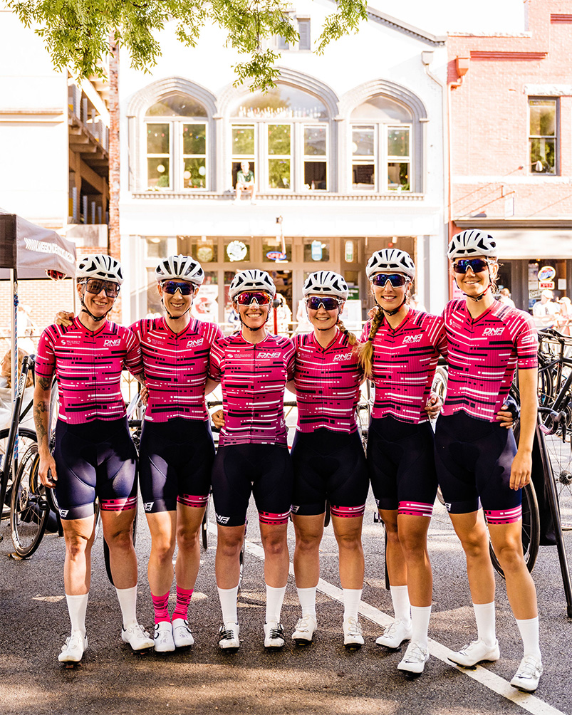 dna pro women's team in pink and blue jersey